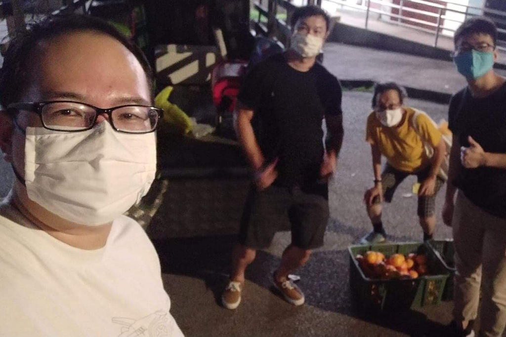In the first week of September, Mr Daniel Tay and several other freegans collected more than 200 oranges and other fruits that had been used as offerings for the dead. u00e2u20acu201d Picture via Facebookn