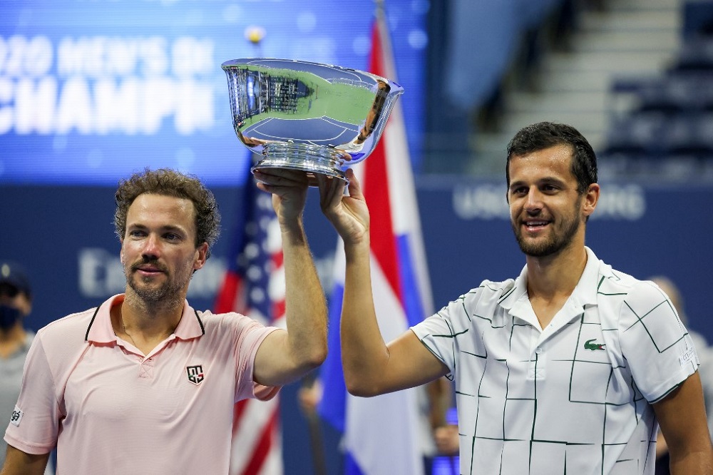 Mate Pavic (right) of Croatia and Bruno Soares (left) of Brazil celebrate with the trophy after winning their Men's Doubles final match on Day Eleven of the 2020 US Open in New York September 10, 2020. u00e2u20acu201d AFP pic 