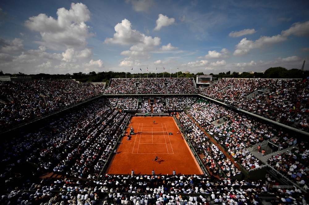 In this file photo taken on June 8, 2018 spectators watch Rafael Nadal as he plays Juan Martin del Potro during their menu00e2u20acu2122s singles semi-final match on day thirteen of The Roland Garros 2018 French Open tennis tournament in Paris. u00e2u20acu201d AFP pic