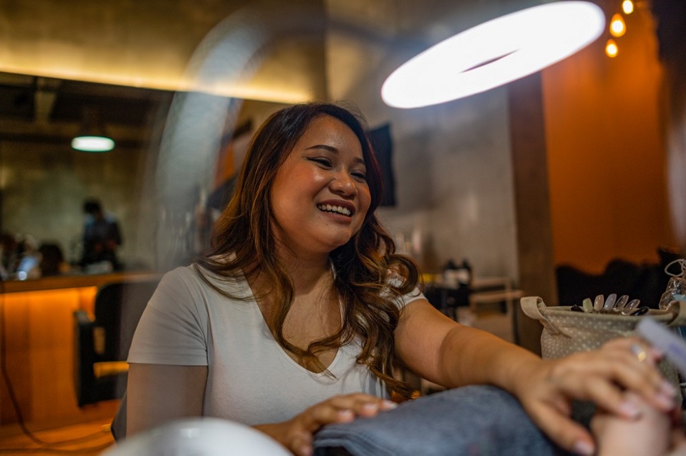 Maryam Lee receiving a manicure at a nail salon in Kuala Lumpur August 17, 2020. — AFP pic 