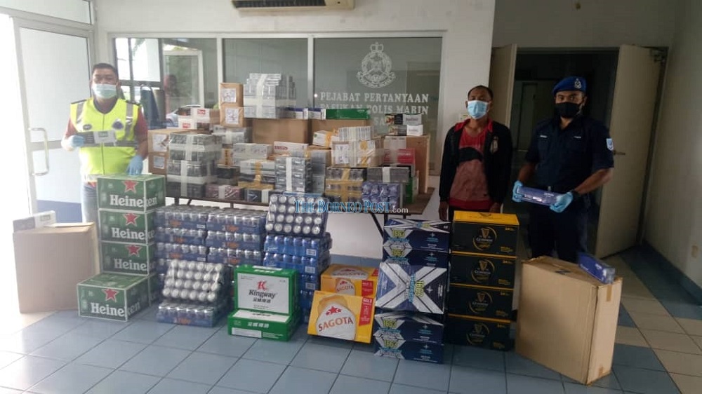 Marine police with the seized contraband. u00e2u20acu201d Borneo Post Online pic