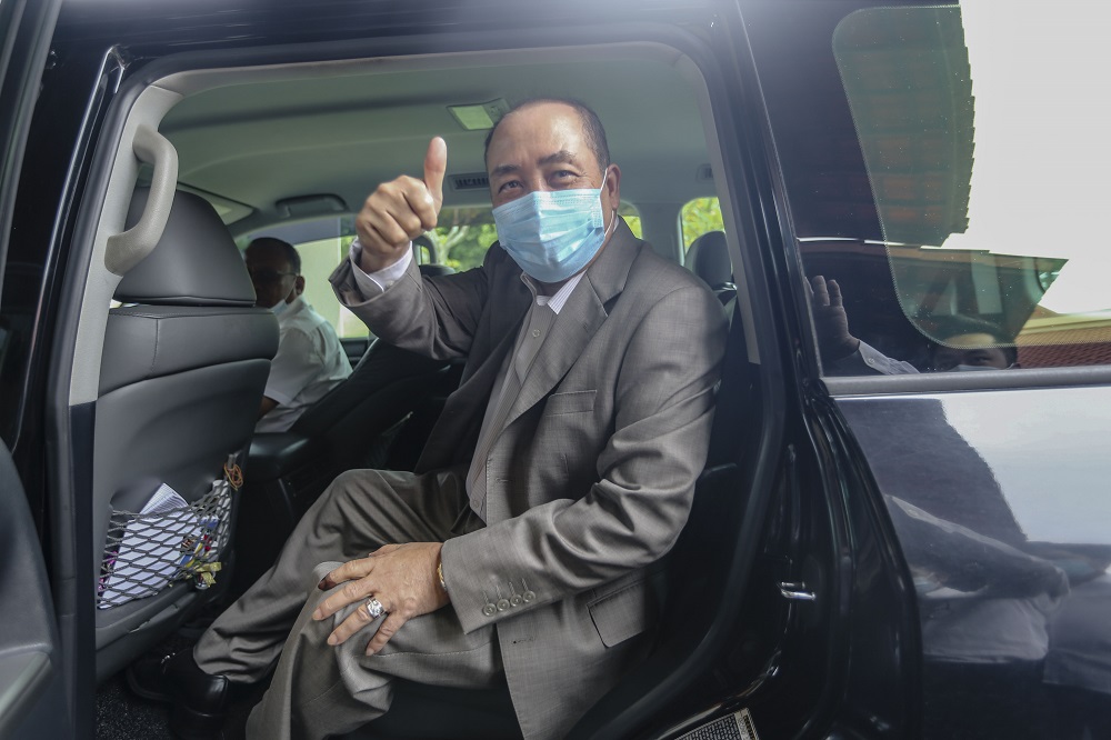 Sabah Bersatu chief Datuk Hajiji Noor leaves Hotel Magellan following a press conference in Kota Kinabalu September 28, 2020. — Picture by Firdaus Latif