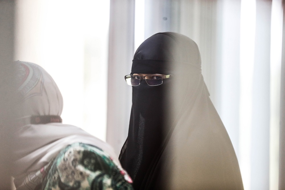 Universiti Sains Malaysia assistant administrative officer Zurina Abdul Hamid is led to the Sessions Court in Butterworth September 28, 2020. u00e2u20acu201d Picture By Sayuti Zainudin