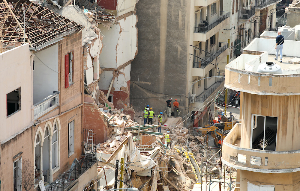 Volunteers and a Chilean rescue team member dig through the rubble of buildings which collapsed due to the explosion at the port area, after signs of life were detected, in Gemmayze, Beirut, Lebanon September 5, 2020. u00e2u20acu201d Reuters picnnn
