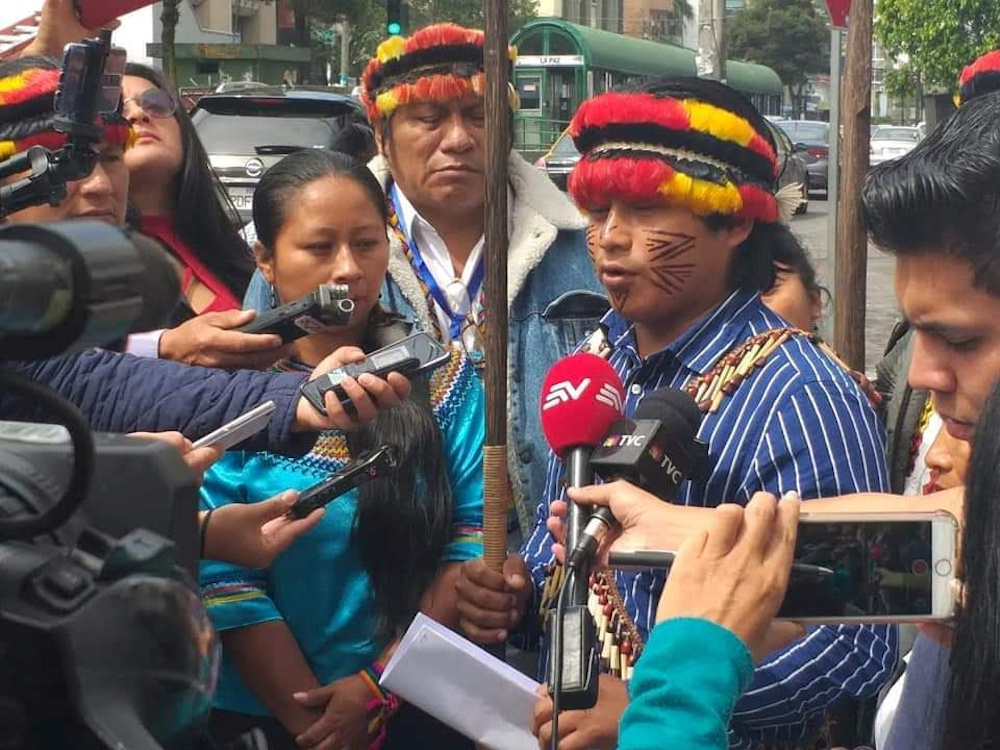 File photo of representatives of the Shiwiar, Sapara and Kichwa indigenous communities gather to deliver a statement opposing the government's state's auction of oil blocks without the free, prior and informed consent of affected communities, in Quito, Ec