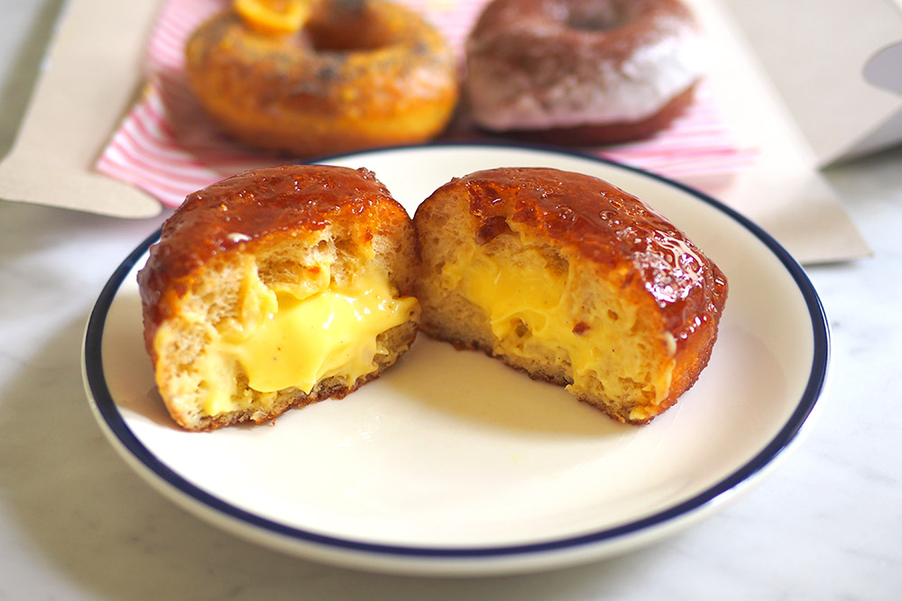 The Créme Brûlée is a decadent doughnut with a filling of silky smooth vanilla créme pâtissérie and a thin brûlée topping.