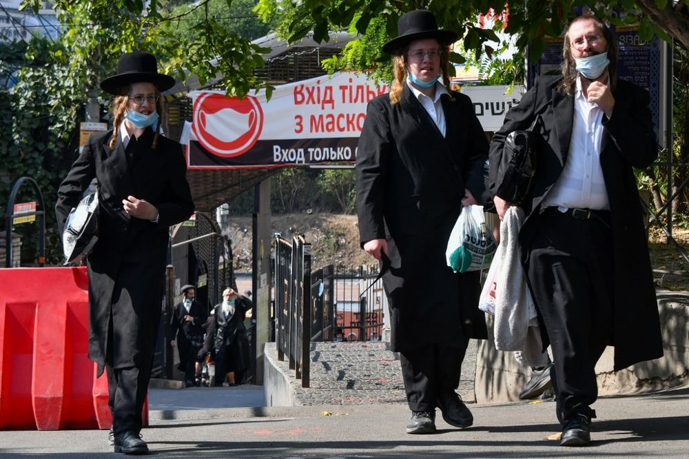 Hasidic Jews wearing face masks to protect against the coronavirus disease walk in the town of Uman in central Ukraine on September 16, 2020, days before the Jewish New Year. u00e2u20acu201dAFP pic