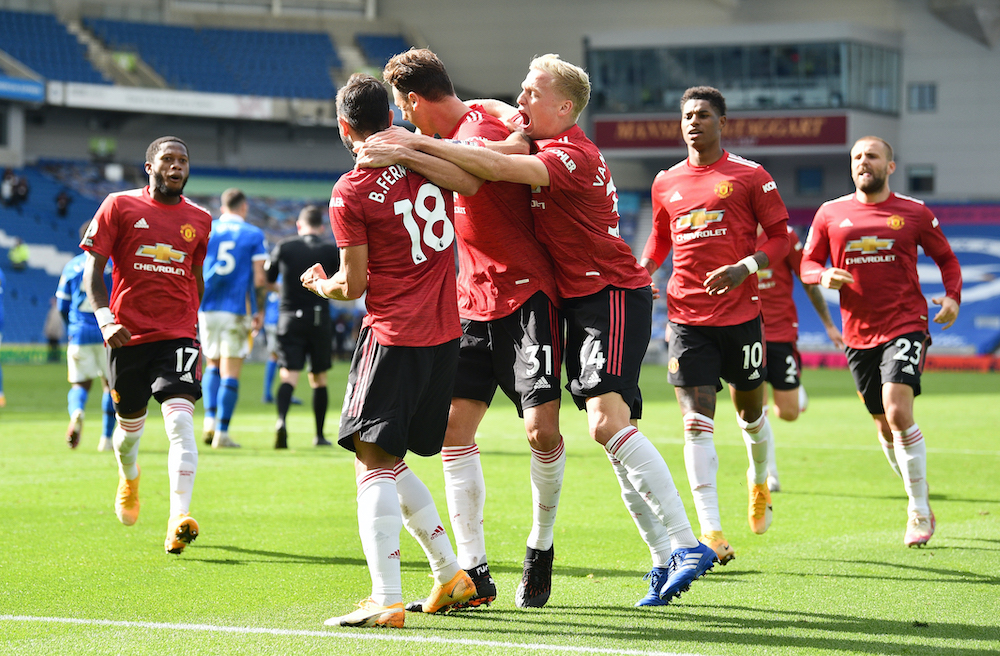 Manchester United's Bruno Fernandes celebrates scoring their third goal with teammates during the match against Brighton & Hove Albion at the American Express Community Stadium in Brighton, September 26, 2020. u00e2u20acu201d Reuters picnn