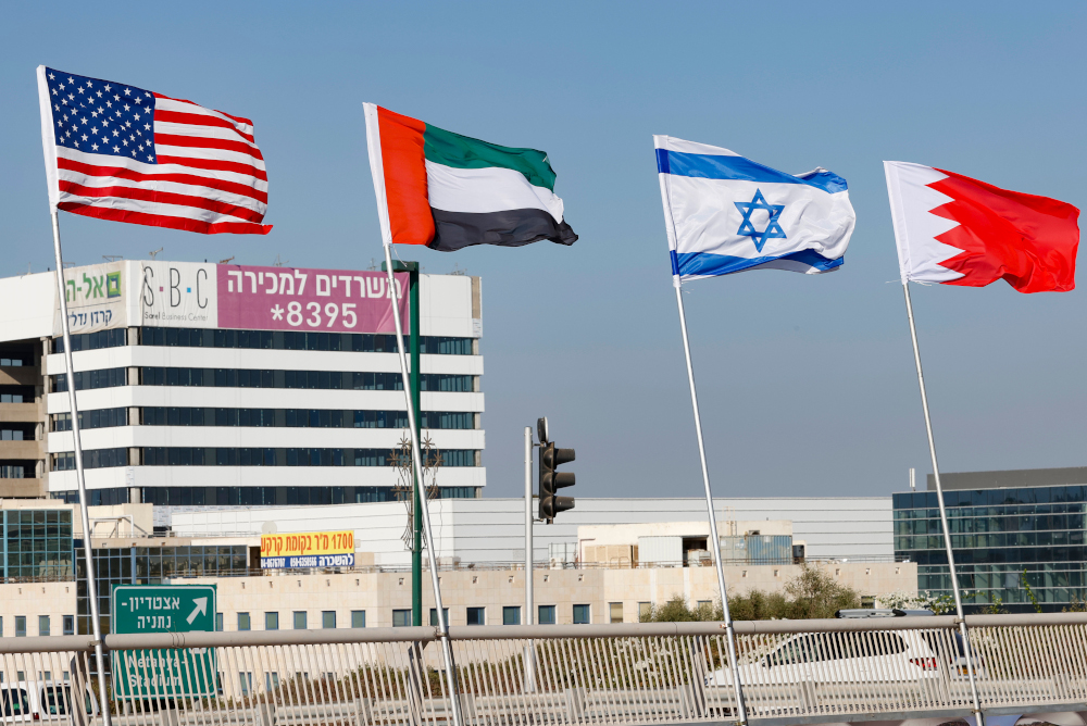 (From left) The flags of the US, the United Arab Emirates, Israel and Bahrain are flown along a road, in the resort city of Netanya in central Israel, September 13, 2020. u00e2u20acu201d AFP pic