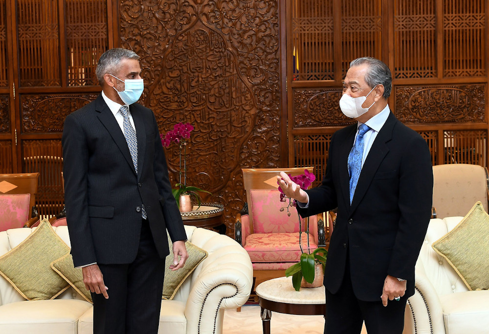 Prime Minister Tan Sri Muhyiddin Yassin receiving a courtesy call from Singapore High Commissioner to Malaysia Vanu Gopala Menon at his office in Putrajaya, September 3, 2020. u00e2u20acu201d Bernama pic 