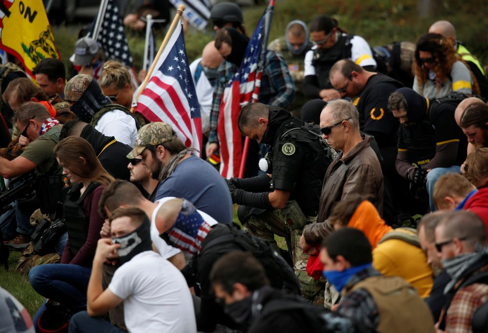 Supporters and members of the far-right group Proud Boys pray before a rally in Portland, Oregon, US, September 26, 2020. u00e2u20acu201d Reuters pic