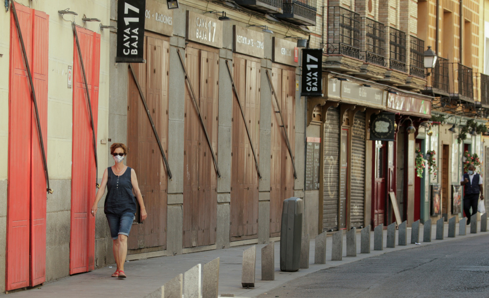 A woman wearing a protective mask walks past closed restaurants, amid the coronavirus disease outbreak, in Madrid, Spain, July 31, 2020. u00e2u20acu201d Reuters pic