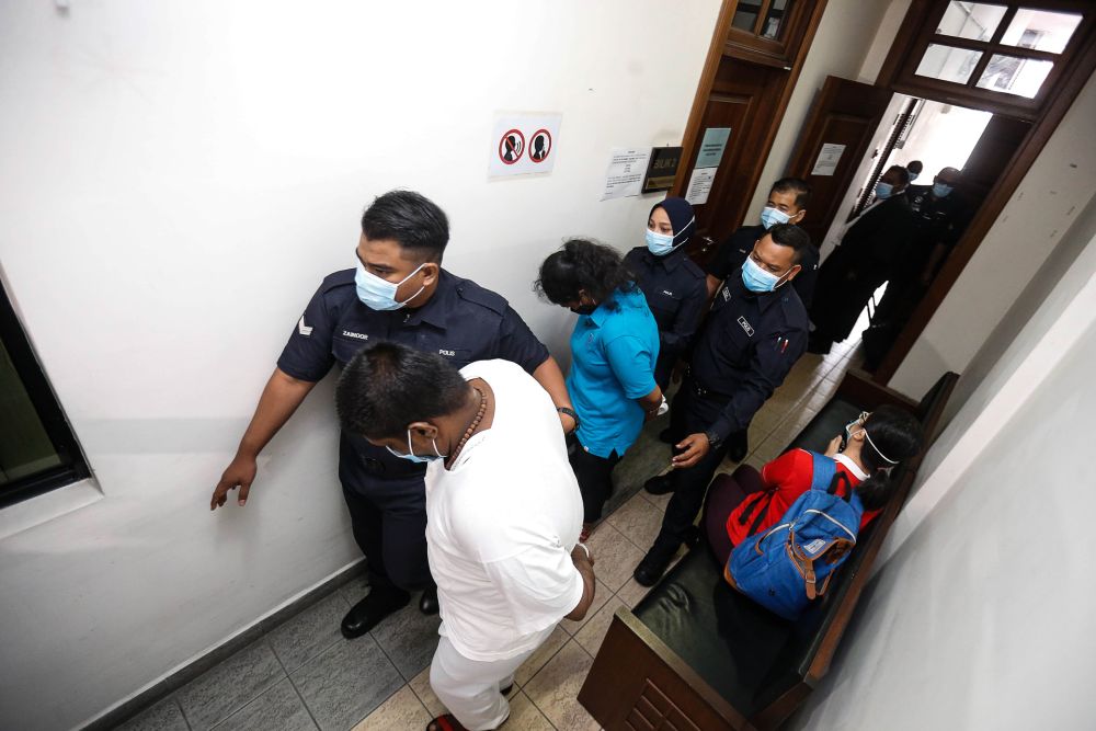 R. Saravanan Kumar and T. Gayathry are pictured at the Penang High Court September 24, 2020. u00e2u20acu201d Picture by Sayuti Zainudin