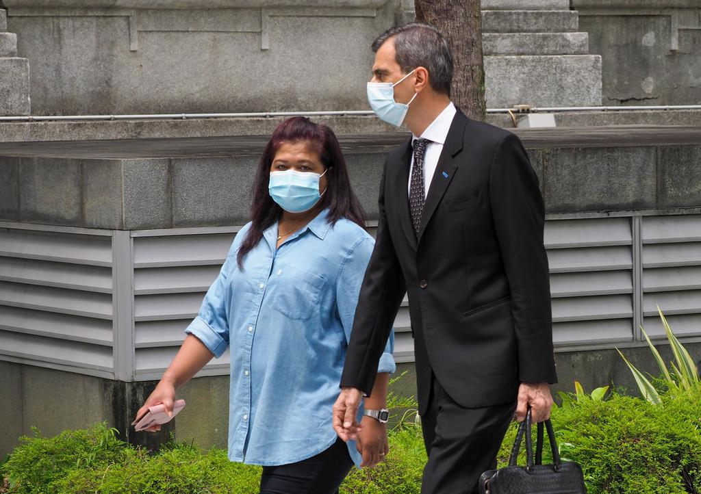 Ms Parti Liyani, whose former employer was Changi Airport Group chairman Liew Mun Leong, and her lawyer Anil Balchandani, arriving at the State Courts on Sept 8, when she was given a discharge amounting to an acquittal for her final charge. u00e2u20acu201d TODAY pic