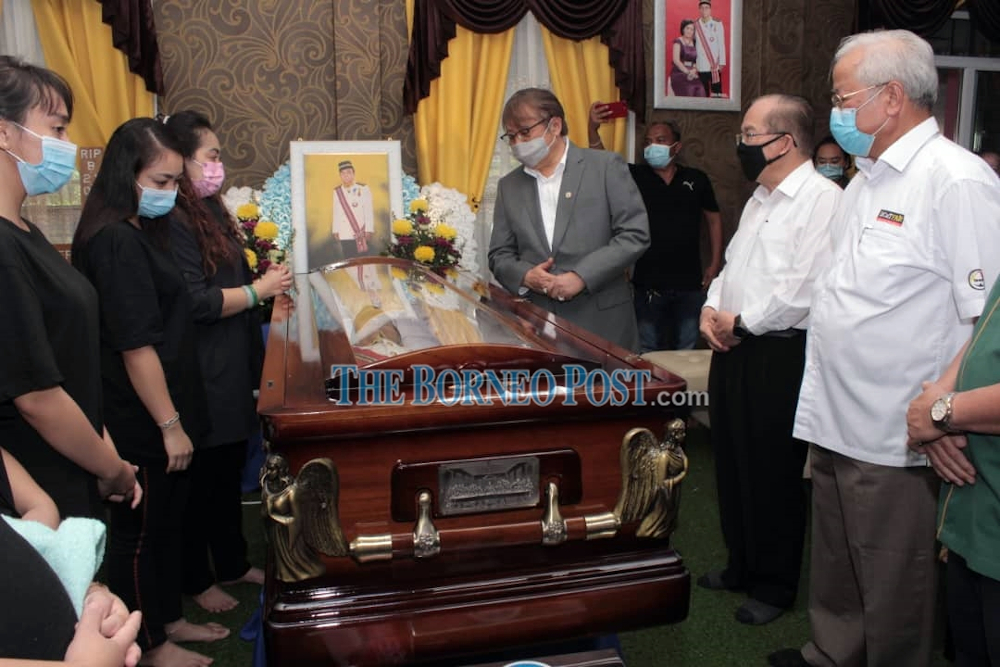 Datuk Patinggi Abang Johari Tun Openg pays his last respects to the late Bayoi. Also seen are (from right) Datuk Sri Michael Manyin Jawong and Datuk Amar Douglas Uggah Embas. u00e2u20acu2022 Borneo Post pic 