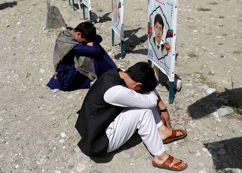 Relatives gather at a graveyard of victims killed in a suicide attack, as Afghan government officials and the Taliban hold peace talks in Doha, in Kabul, Afghanistan September 14, 2020. u00e2u20acu201d Reuters pic