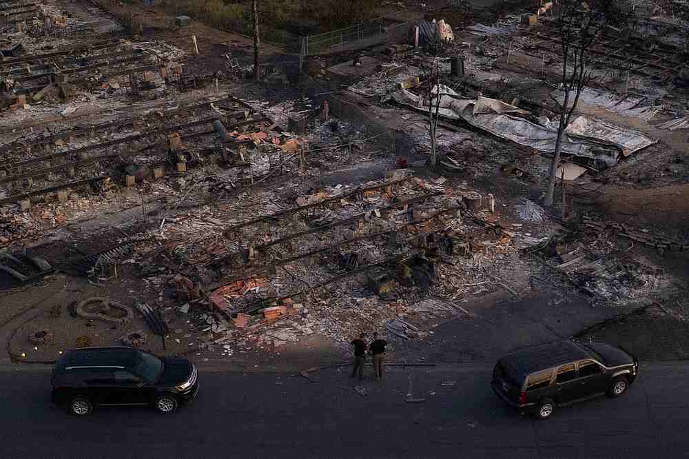 Security officials survey the Bear Lakes Estates neighborhood which was left devastated by the Almeda fire in Phoenix, Oregon September 9, 2020. u00e2u20acu201d Reuters pic taken with a drone