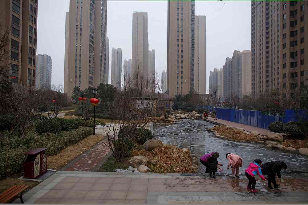 People play with ice floats at a pond in the compound of an apartment complex in Zhengzhou, Henan province, China February 20, 2019. u00e2u20acu201d Reuters pic