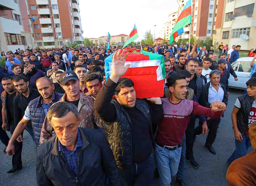 People carry the coffin of a member of Azerbaijani Armed Forces, who was allegedly killed during the fighting over the breakaway region of Nagorno-Karabakh, during a funeral in Azerbaijan September 29, 2020. u00e2u20acu201d Reuters pic