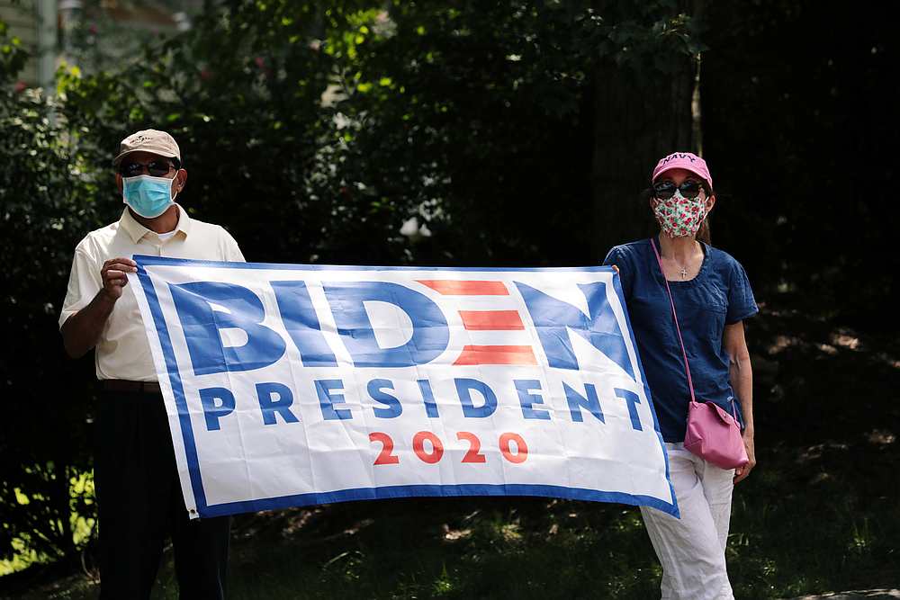 Protesters hold a banner in support of presidential candidate Joe Biden outside Trump National Golf Club, in Sterling, Virginia August 30, 2020. u00e2u20acu201d Reuters pic