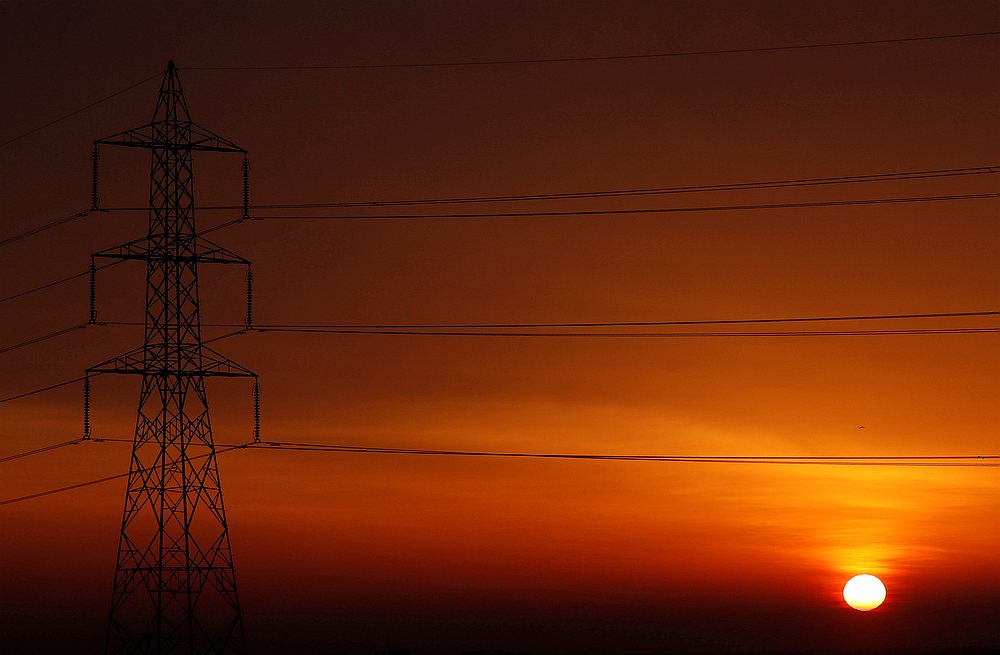 The sun is seen behind high-voltage power lines and electricity pylons at a highway northeast of Cairo, Egypt March 13, 2019. u00e2u20acu201d Reuters pic
