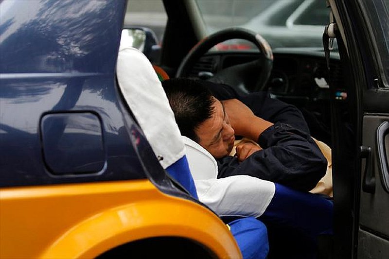 While it may seem pretty comfy to sleep in your car with the AC on, you are actually putting yourself at risk. — Reuters pic