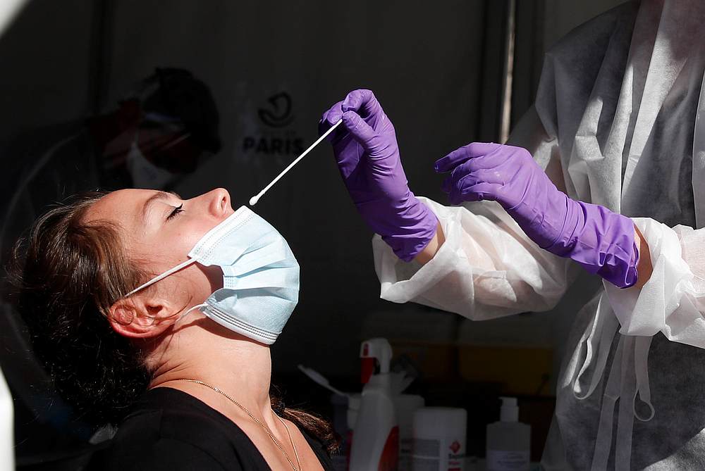 A health worker prepares to administer a nasal swab to a patient at a testing site for Covid-19 in Paris, France, September 14, 2020. u00e2u20acu201d Reuters pic