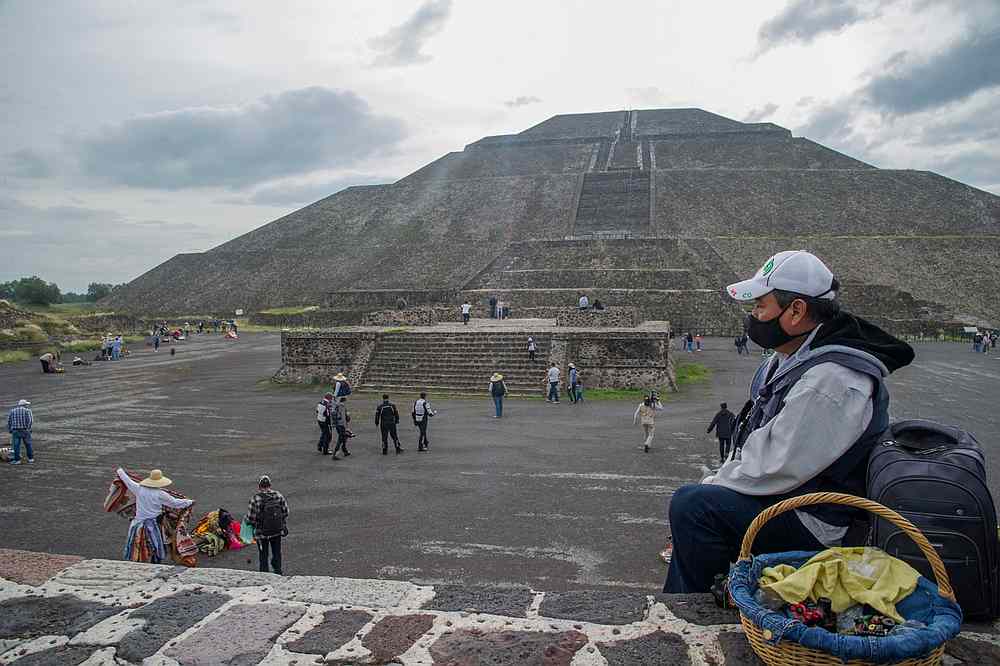 A handicraft vendor waits for tourist at the archaeological site of Teotihuacan, one of Mexico's top tourist attractions, during its reopening amid the Covid-19 pandemic. u00e2u20acu201d AFP pic