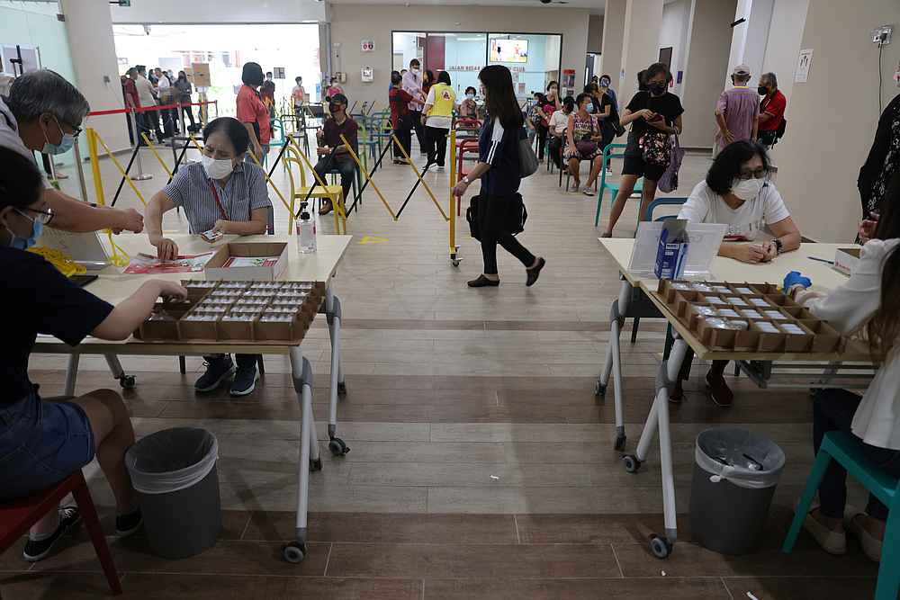 TraceTogether tokens are distributed to residents at Jalan Besar Community Club, as the government speeds up contact tracing efforts to curb the spread of Covid-19, in Singapore September 14, 2020.  u00e2u20acu201d Reuters pic
