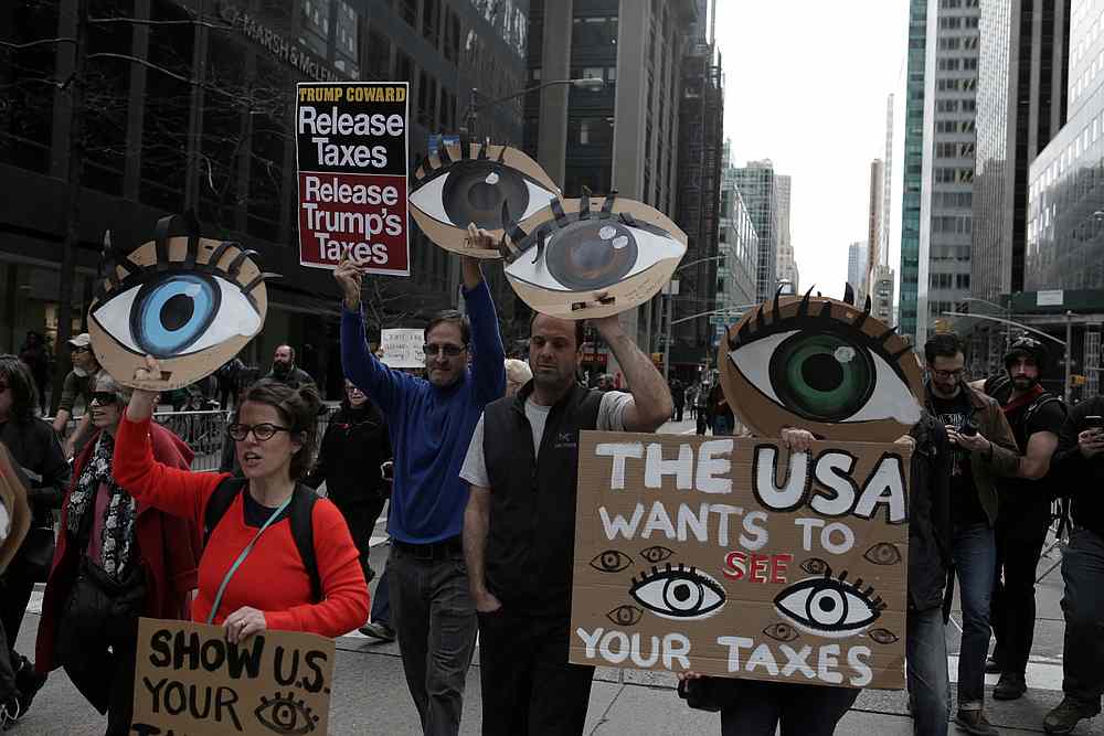 People march demanding US President Donald Trump release his tax returns, in New York April 15, 2017. u00e2u20acu201d Reuters pic