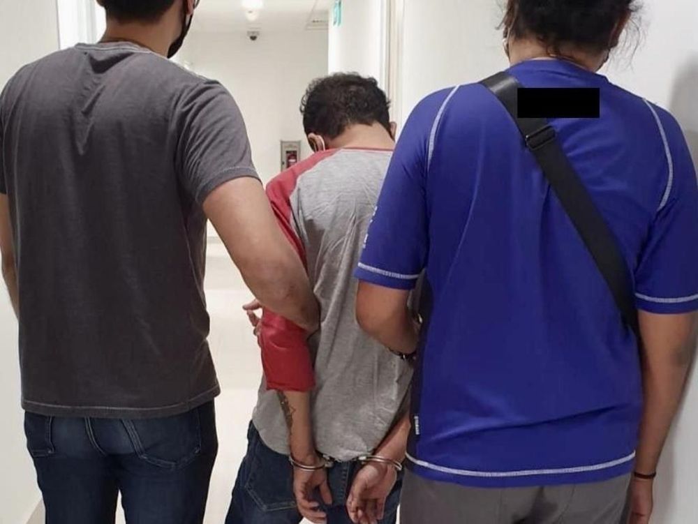 Officers from the Central Narcotics Bureau raided the hideout of a 29-year-old Singaporean man, who was the passenger in the car chase along Canberra Street on Sept 12, 2020. u00e2u20acu201d TODAY pic