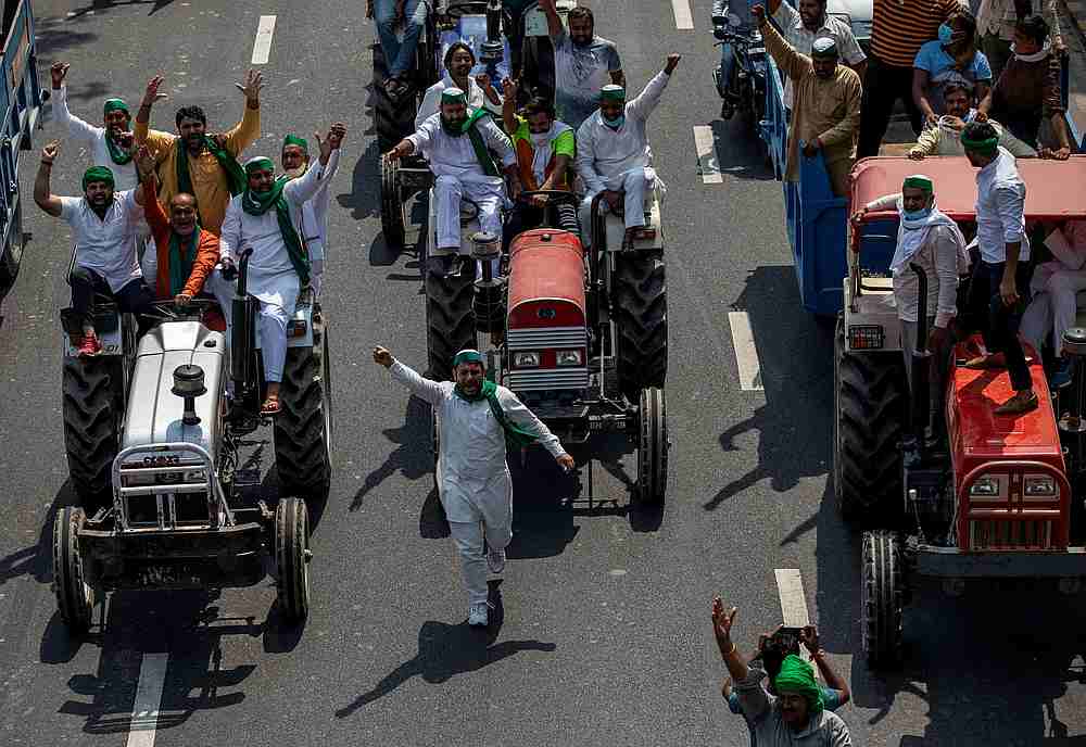 Farmers on tractors shout slogans as they arrive to block the Delhi-Uttar Pradesh border during a protest against farm bills passed by India's parliament, in Noida, India, September 25, 2020. u00e2u20acu201d Reuters pic