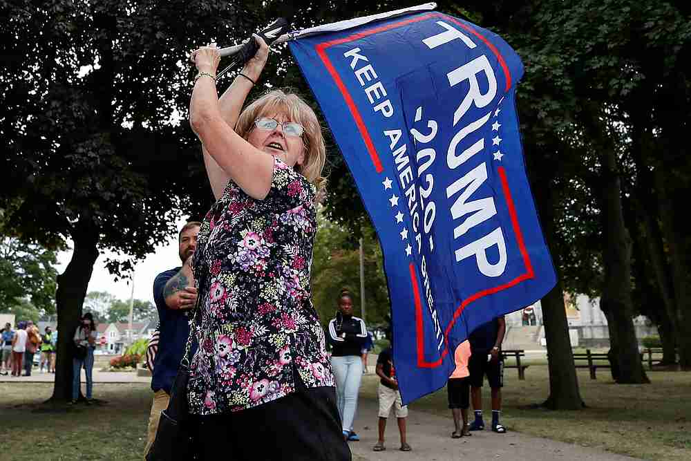 US President Donald Trump supporter waves a flag at Civic Center Park during his visit in Kenosha, Wisconsin September 1, 2020. u00e2u20acu201d Reuters pic