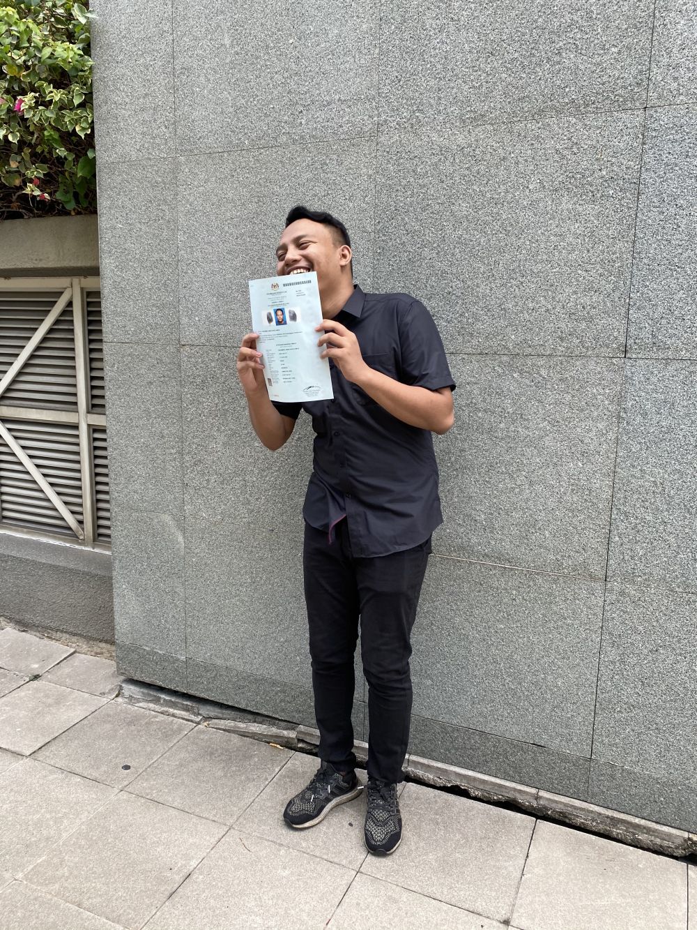 Aiman and his long-awaited official paper certifying that he is a Malaysian citizen. ― Picture courtesy of Lee Yee Woei