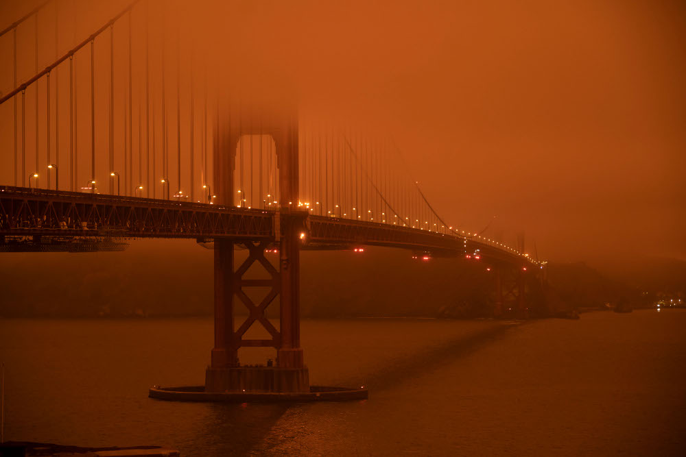 Cars drive along the Golden Gate Bridge under an orange smoke filled sky at midday in San Francisco, California September 9, 2020. u00e2u20acu201d AFP pic 