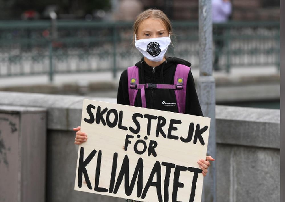 Climate activist Greta Thunberg holds a poster reading u00e2u20acu02dcSchool strike for Climateu00e2u20acu2122 as she protests in front of the Swedish Parliament Riksdagen, in Stockholm, Sweden, September 4, 2020. u00e2u20acu201d TT News Agency pic via Reuters