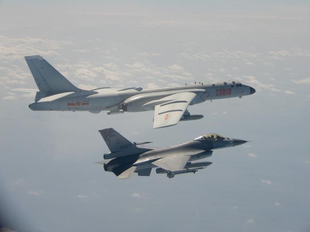 An H-6 bomber of Chinese PLA Air Force flies near a Taiwan F-16 in this February 10, 2020 handout photo provided by Taiwan Ministry of National Defense. u00e2u20acu201d Taiwan Ministry of National Defense/Handout via Reuters