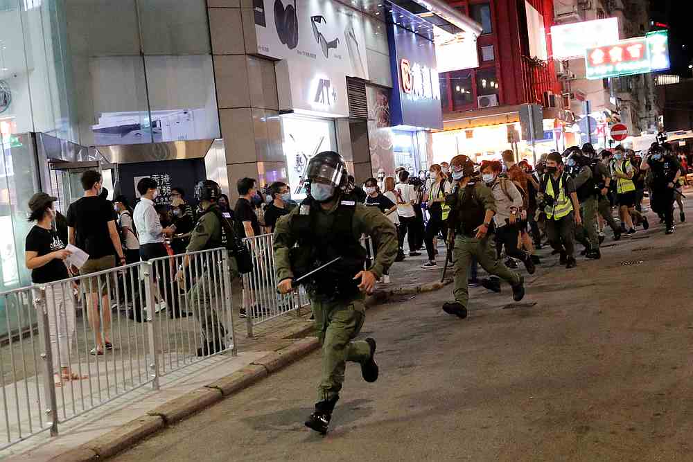 Riot police chase pro-democracy protesters during a protest near Prince Edward station to mark one year since authorities stormed the underground station at Mong Kok in Hong Kong August 31, 2020. u00e2u20acu201d Reuters pic