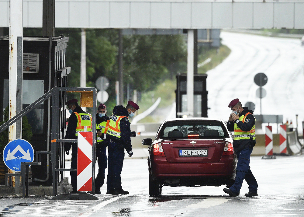 Hungarian police officers check the papers of commuters at the Austrian-Hungarian border crossing point in Klingenbach, Austria, near Sopron, Hungary September 1, 2020. u00e2u20acu201d AFP pic