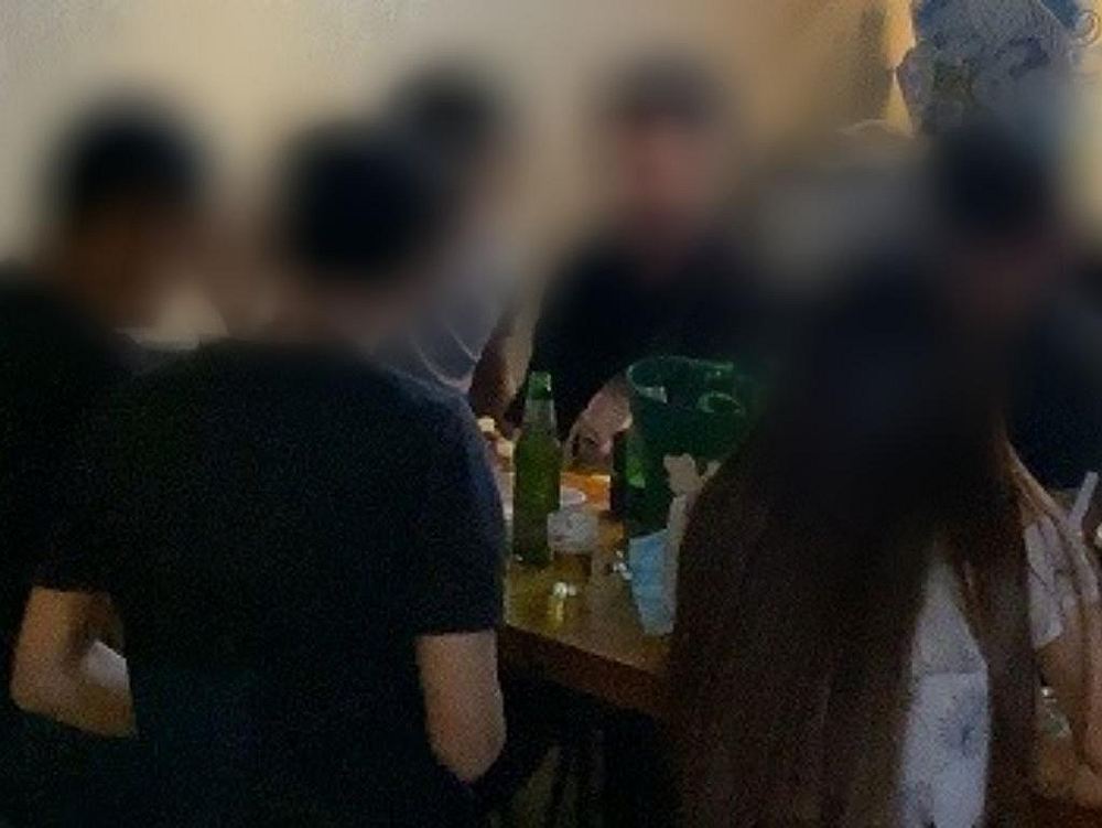 A group of 8 customers were found sitting together at a long table in an F&B outlet in Jurong East, Singapore. u00e2u20acu201d Picture courtesy of MSE via TODAY