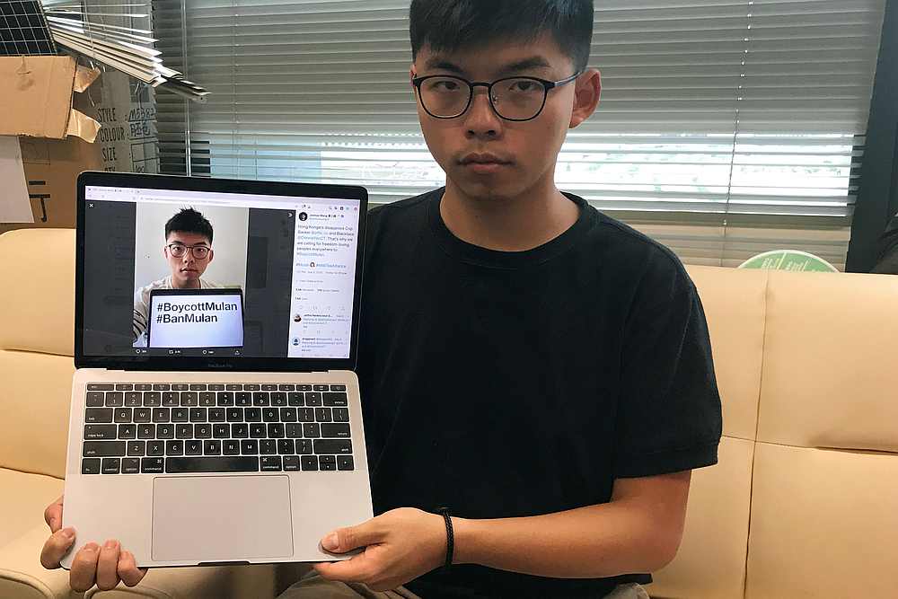Pro-democracy activist Joshua Wong holds a laptop displaying his Twitter post which calls for a boycott of Disney's film 'Mulan,' in Hong Kong, September 8, 2020. u00e2u20acu201d Reuters pic
