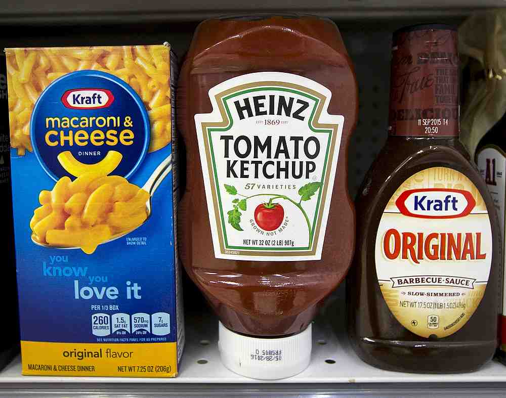 A Heinz Ketchup bottle sits between a box of Kraft macaroni and cheese and a bottle of Kraft Original Barbecue Sauce on a grocery store shelf in New York March 25, 2015. u00e2u20acu201d Reuters pic