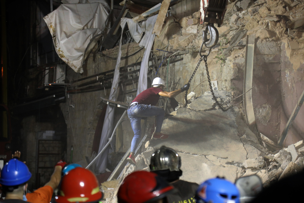 Lebanese and Chilean rescuer workers dig through the rubble of a badly damaged building in Lebanonu00e2u20acu2122s capital Beirut in search of possible survivors after scanners detected a pulse, September 4, 2020. u00e2u20acu201d AFP pic 
