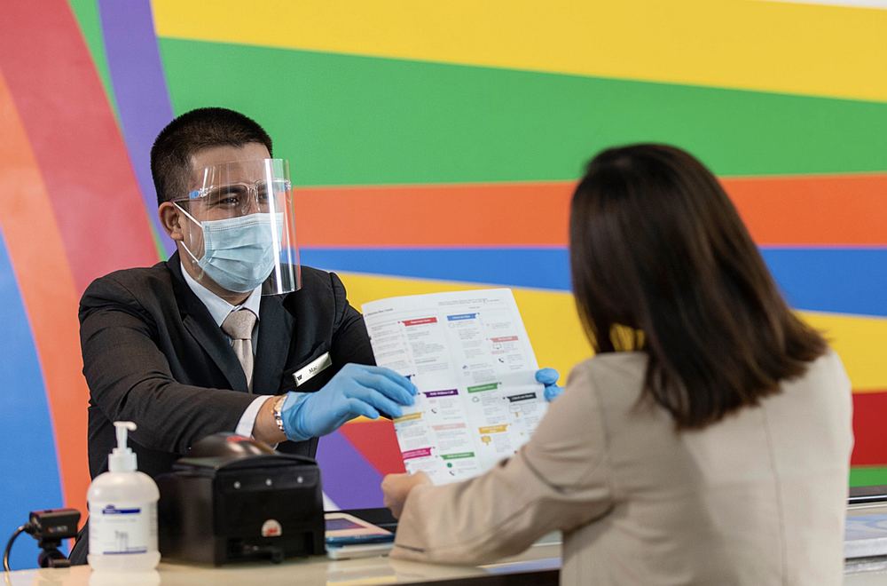 A hotel employee greeting a guest at Marina Bay Sands. The resort in Singapore is still looking to fill some job vacancies. u00e2u20acu201d Picture courtesy of Marina Bay Sands/Facebook via TODAY