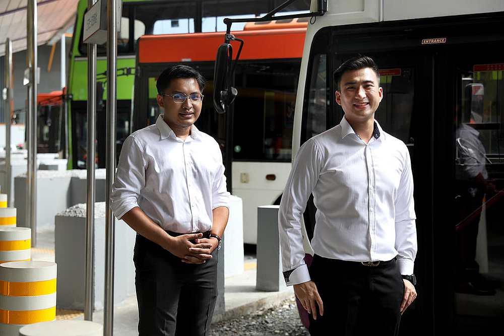 Muhammad Mu'tasim (left) and Clement Tan (right), along with another man, helped an SBS Transit bus driver who was being attacked by a passenger. u00e2u20acu201d TODAY pic