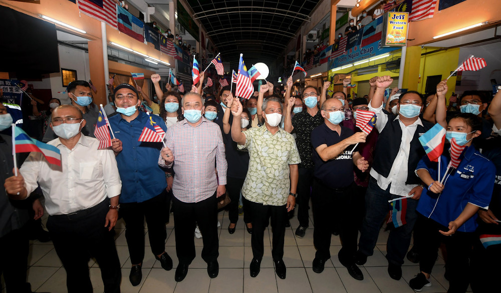 Prime Minister Tan Sri Muhyiddin Yassin and his supporters wave the Jalur Gemilang at a gathering at Hilltop Luyang in Kota Kinabalu September 23, 2020. u00e2u20acu201d Bernama pic 