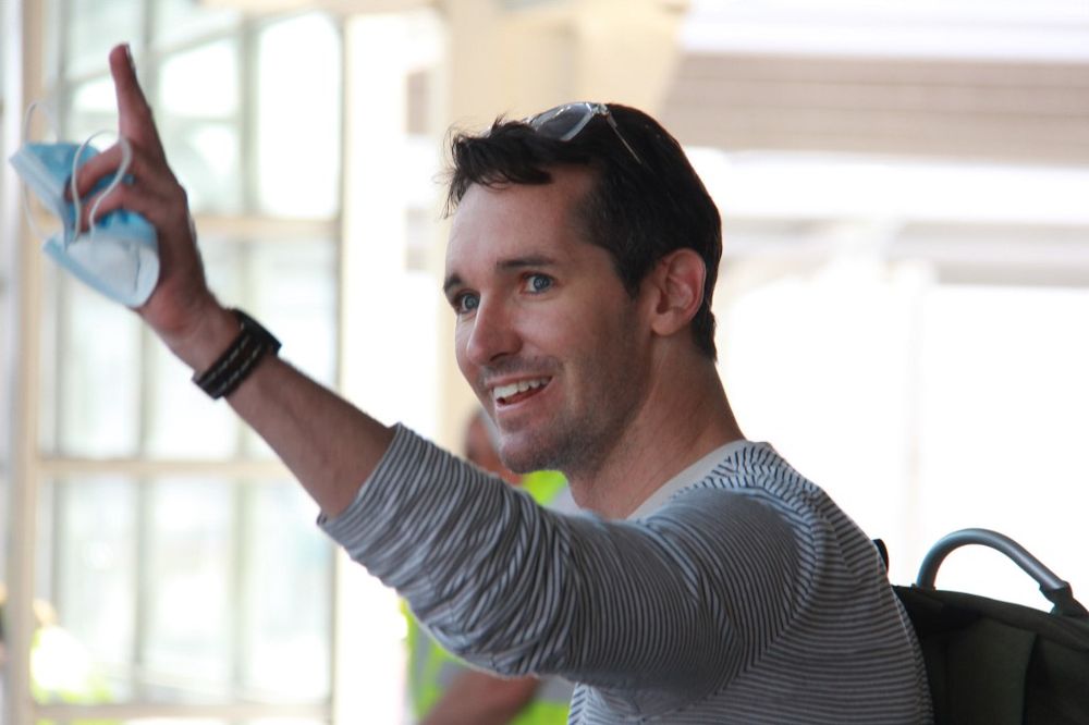 This handout photograph taken and released on September 8, 2020 by ABC News shows Australian Broadcasting Corporation journalist Bill Birtles waving as he arrives in Sydney after leaving China over arrest fears. u00e2u20acu201d AFP pic 