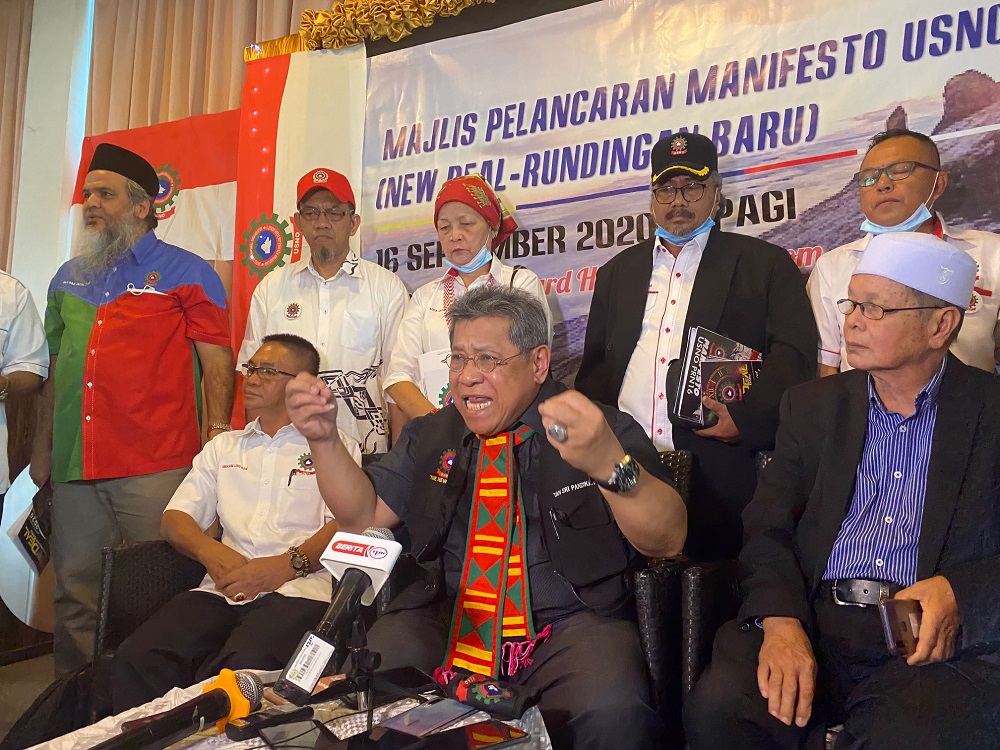 Usno Baru president Tan Sri Pandikar Amin Mulia (centre) speaks during the partyu00e2u20acu2122s manifesto launch at the Courtyard Hotel in 1Borneo Shopping Centre, Kota Kinabalu September 16, 2020. u00e2u20acu2022 Picture by Julia Chan