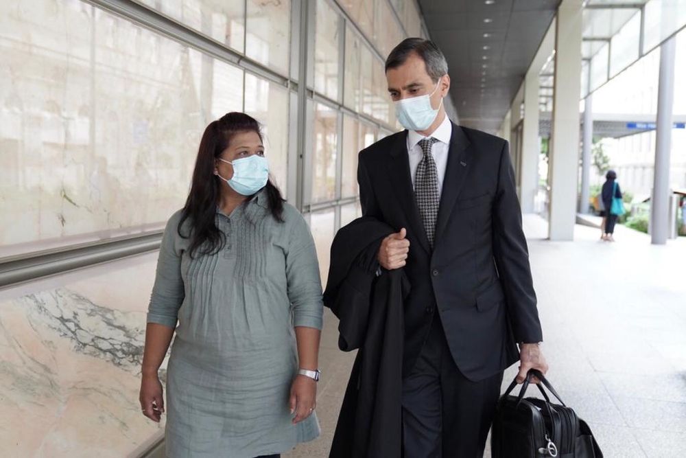 Parti Liyani, 46, and her lawyer, Anil Balchandani from Red Lion Circle, leaving the High Court on September 4, 2020. u00e2u20acu201d Grace Baey pic via TODAY