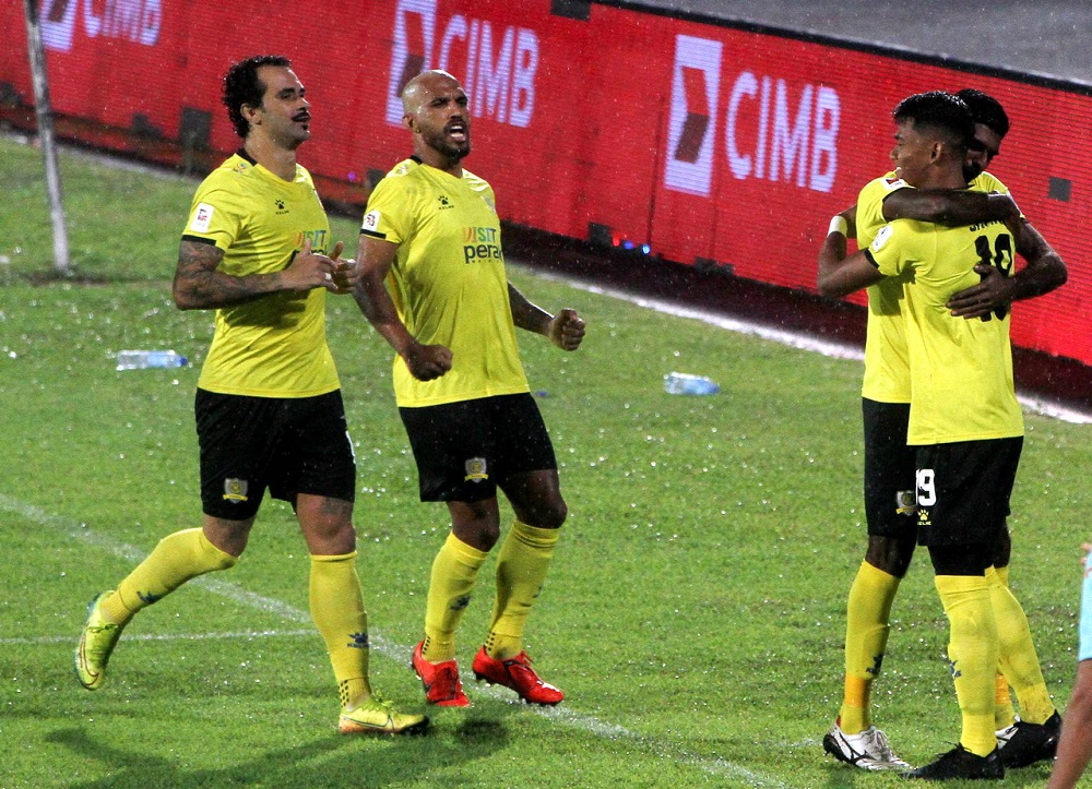 Peraku00e2u20acu2122s Muhammad Shahrel Fikri Md Fauzi (right) celebrates after scoring a goal against UiTM FC Septmerb 11, 2020. u00e2u20acu2022 Bernama pic